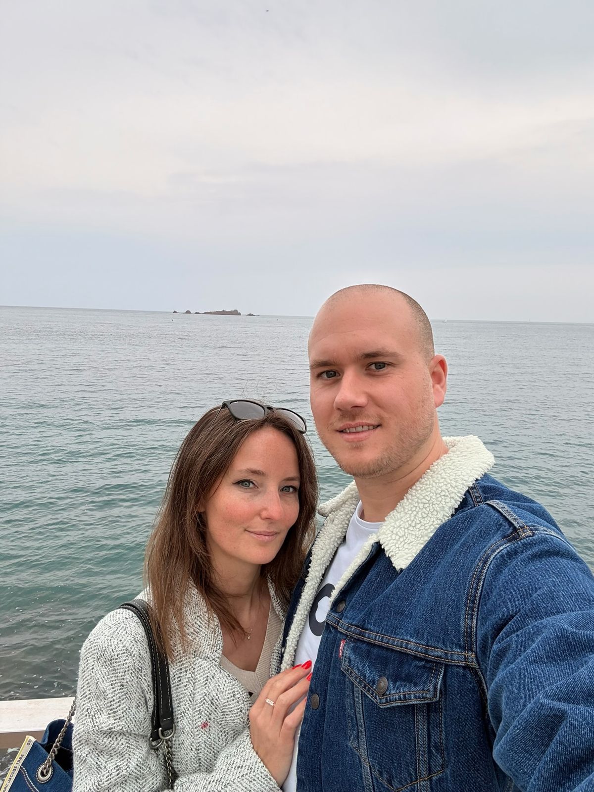 Adrien and Emily, founders of Adrien & Emily Consulting, by the sea