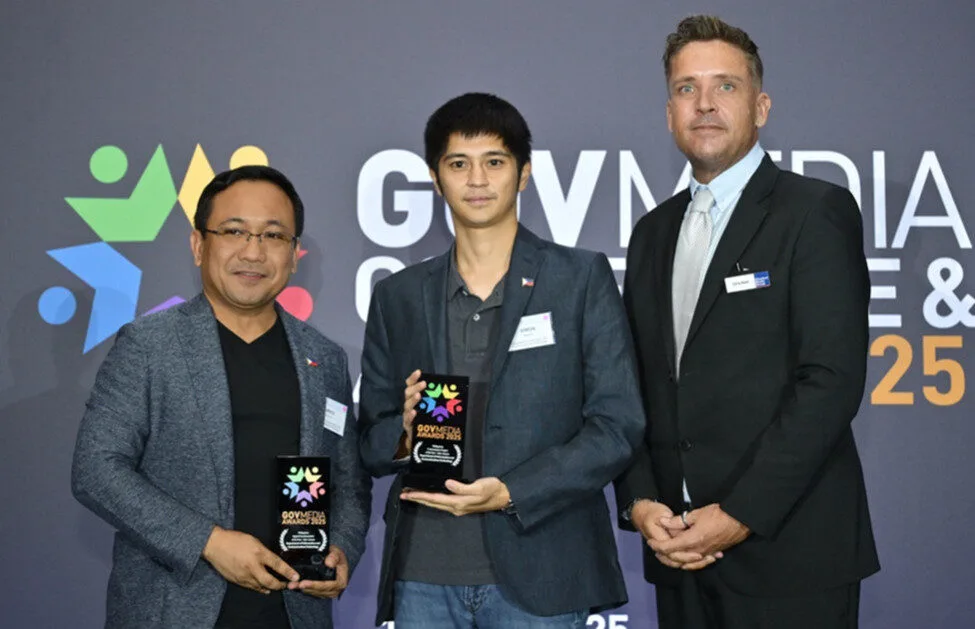 Photo shows: DICT Undersecretary for E-Government David Almirol and Joseph Simon Araneta Marcos receiving the Philippines’ GovMedia Awards in Singapore.