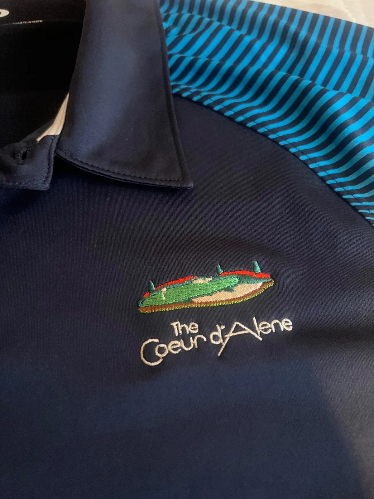 NEW The Coeur D’Alene Oakley Golf Shirt Blue Size L