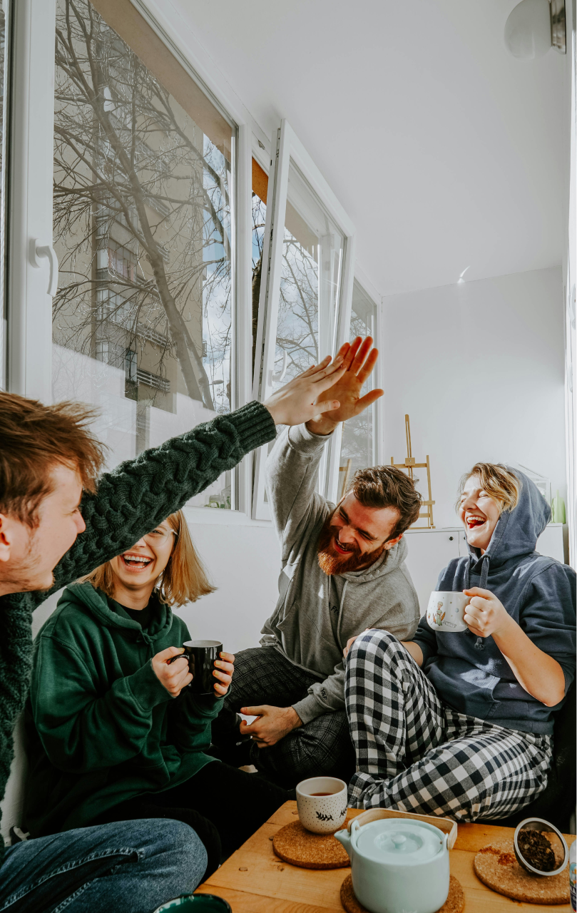 Hero image of friends clapping