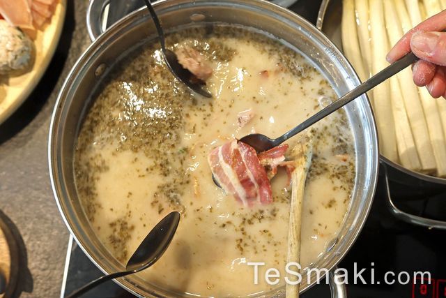 Traditional Polish Sour Rye Soup in Bread with White Sausage and Bacon
