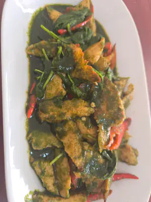 Stir-fried water spinach with plant-based protein.