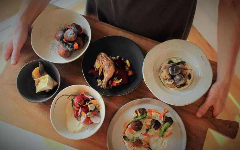 Dishes at Emmer & Rye, showcasing farm-to-table ingredients