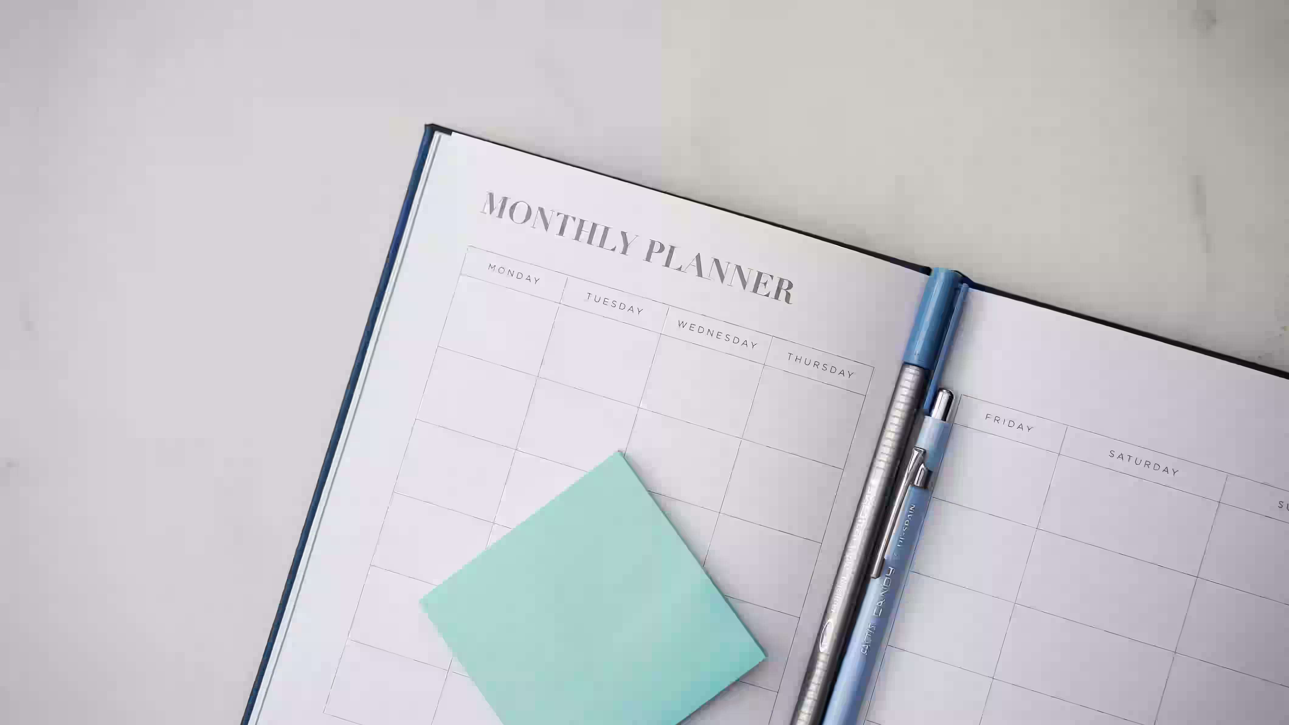 Open desk calendar used to track quarterly tax payment deadlines