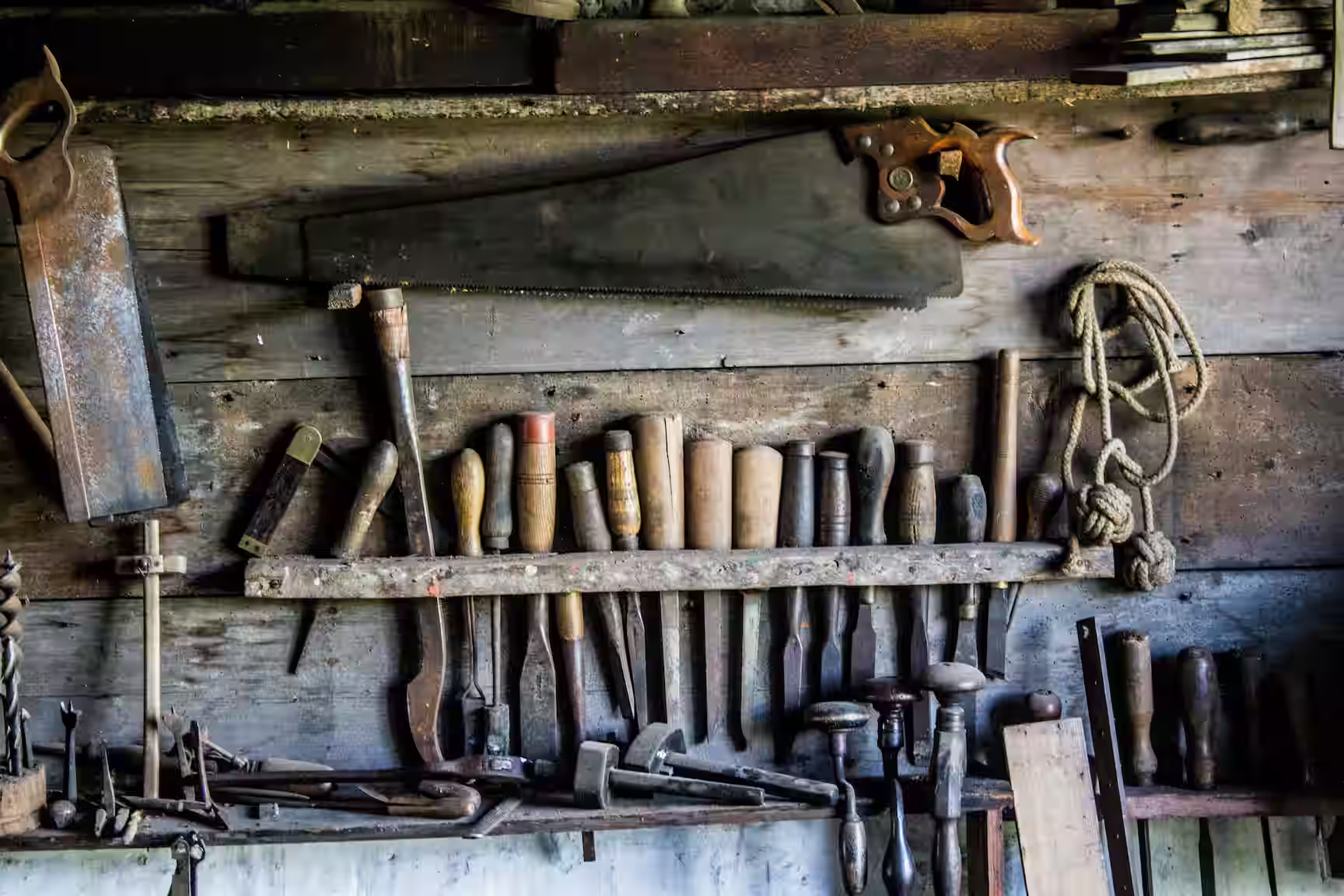 Vintage carpenter workshop with hand tools and wood framing materials