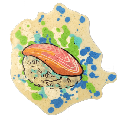 A piece of nigiri sushi depicted in pancake art, showing a slice of fish with pink, orange, and white layered markings resting on a mound of rice rendered with small curved line details suggesting individual grains. Bold black outlines define the sushi forms, with a cream-colored background splatte…