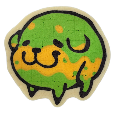 Pancake art depicting Poffridge, a Shiba Inu–shaped sentient poffertje from the JoP cast, shown as a round, slightly lumpy face with small dot eyes, a compact snout with two curved nostrils, and a wavy drip or melt effect along the bottom edge. Drawn by Dan using bold black outlines and broad fill…