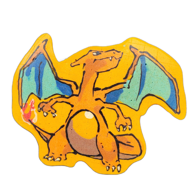 Pancake art depicting Charli rendered in the visual style of the fan-requested Pokémon Charizard — an orange, bipedal dragon-like figure with teal and blue wings spread wide, a cream-colored belly, clawed feet and hands, and a small red and orange flame held in one raised hand, all set against a br…