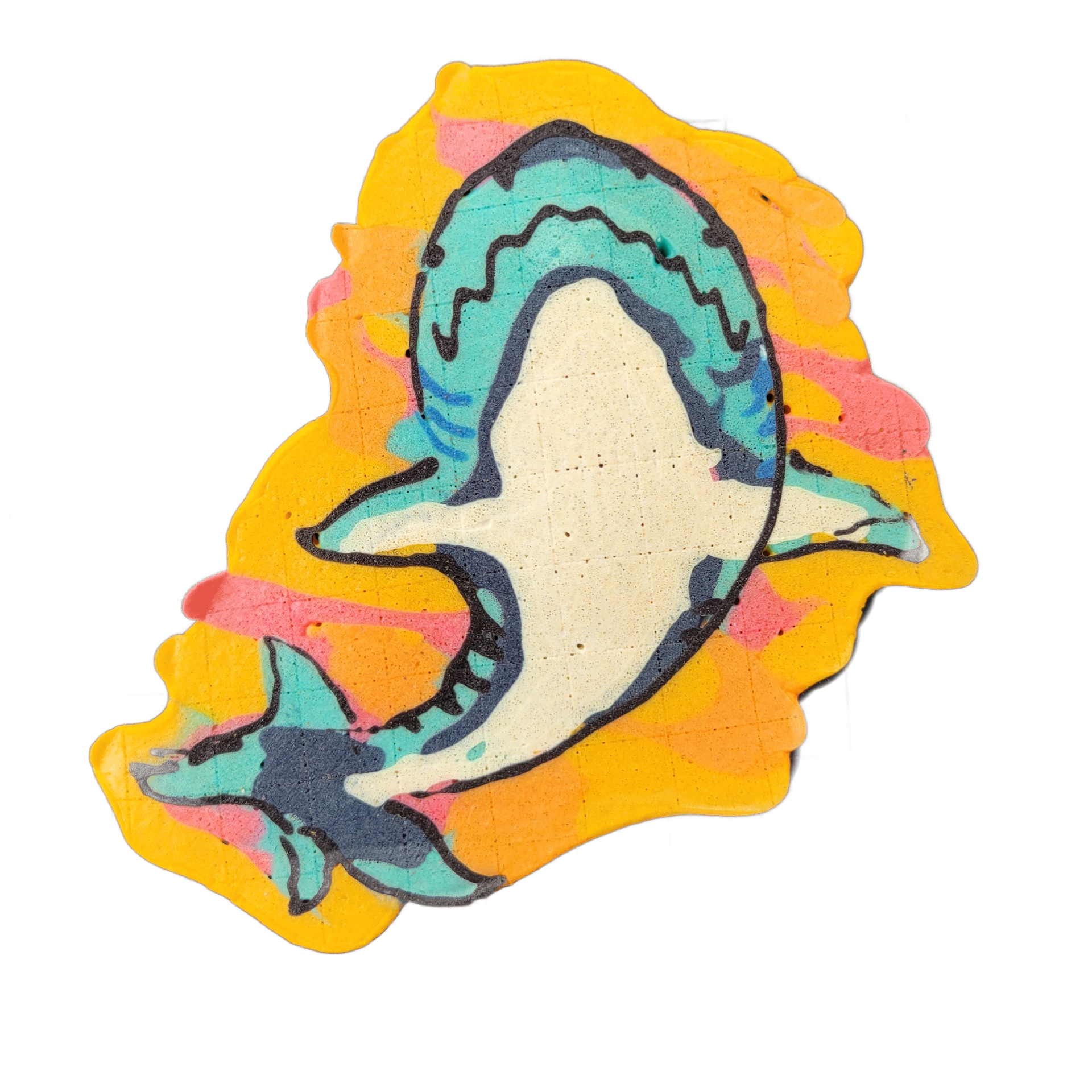 A shark drawn in pancake art, shown in a curved body position with its mouth open, teeth visible, and pectoral and tail fins extended; a smaller shark or fish shape appears near the lower left, partially behind the main figure.