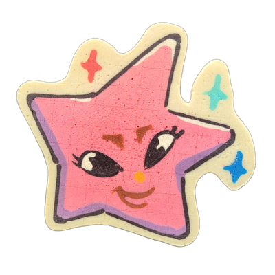 Pancake art depicting Charli, an original character from the JoP cast conceived as one of the stars from Vincent van Gogh's The Starry Night, rendered here as a five-pointed star shape with a cartoon face featuring large lashed eyes, rosy cheeks indicated by brown triangular marks, a small orange c…