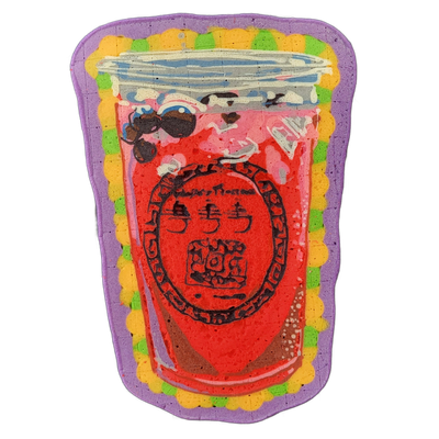 Pancake art depicting a large cup of fresca or fruit drink, filled with a deep red liquid, dark tapioca-like pearls near the top, and a clear plastic lid with a straw indicated by white highlight lines; a circular logo or label element with Chinese or stylized characters appears in the center of th…