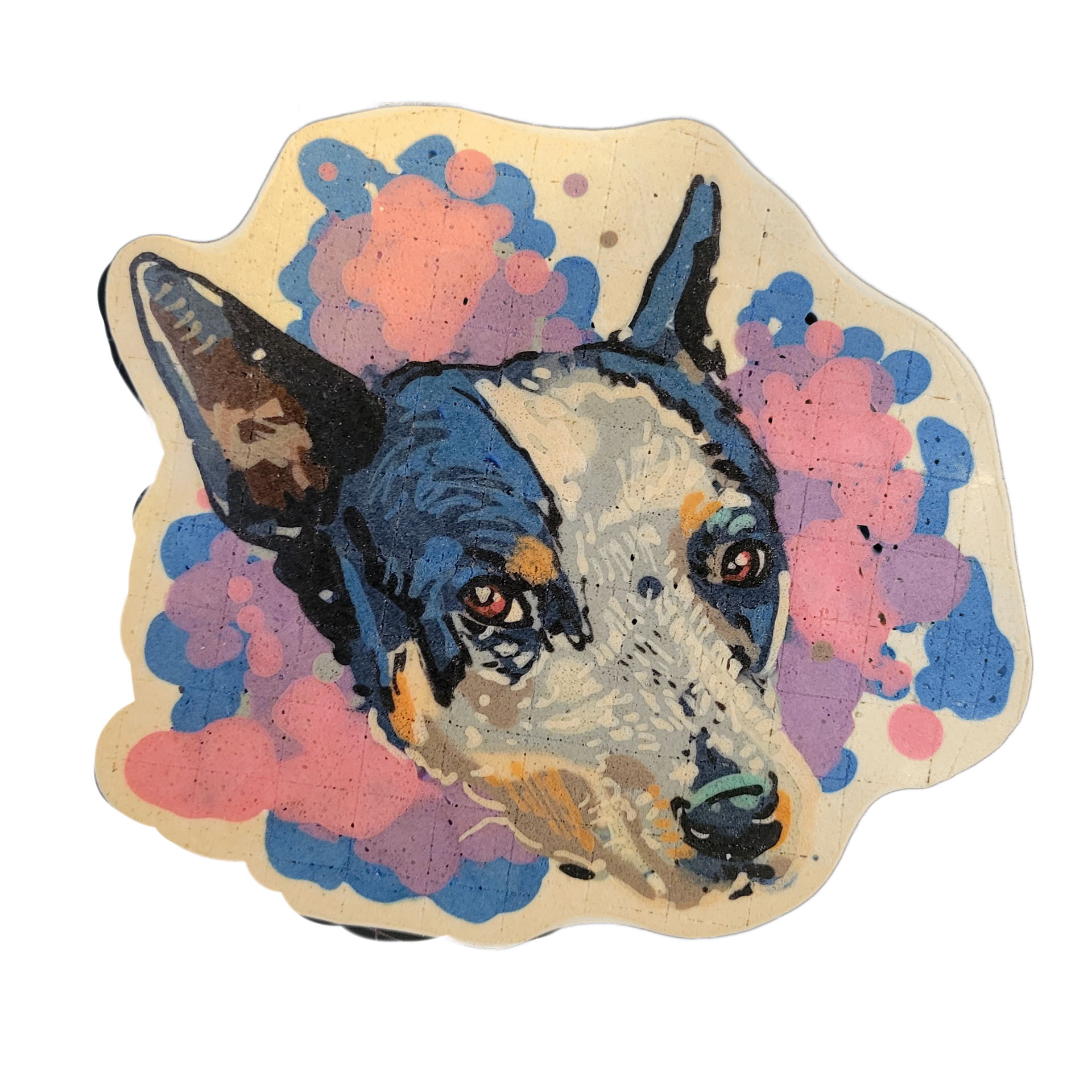 Pancake art of a dog's head, facing slightly downward and to the right, with pointed upright ears, a broad white muzzle, and dark markings around the eyes and top of the head consistent with an Australian Cattle Dog or similar breed. The portrait is rendered with bold black outlines and filled with…