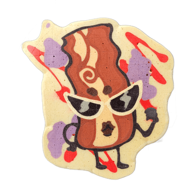 Pancake art depicting Sugar, a bacon strip character from the JoP cast, rendered as an upright anthropomorphic figure wearing large white-framed cateye sunglasses with dark lenses, with two small arms, two legs ending in red feet, and stylized brown and tan marbling across the body. Bold dark outli…