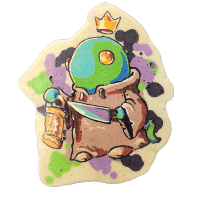 Pancake art depicting King Tonberry, a small hooded creature with a large round head displaying a blue-and-green globe pattern and a flame crown on top, holding a knife in one clawed hand and a glowing lantern in the other, surrounded by splatters in violet, green, and dark brown-black. Rendered by…