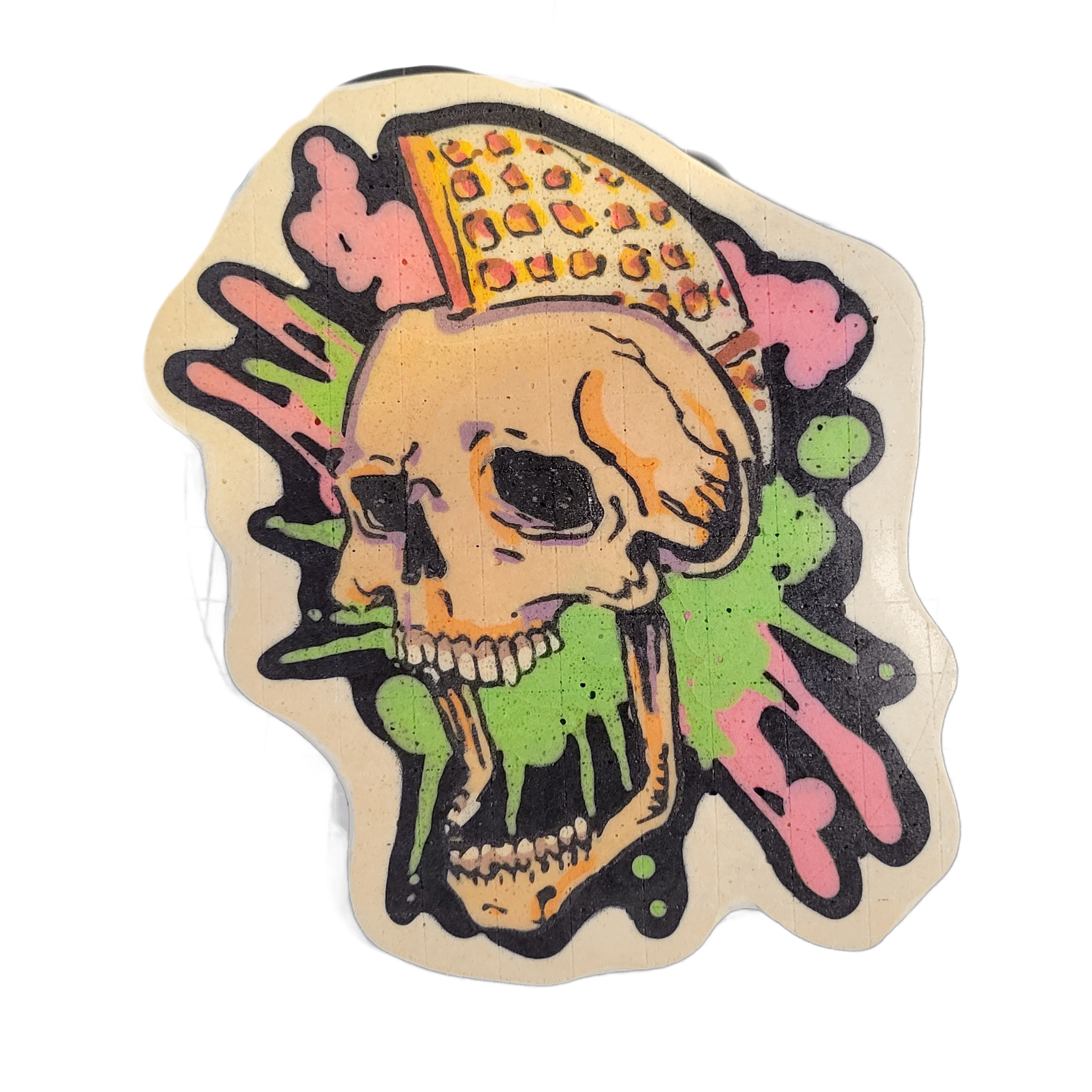Pancake art depicting a human skull in three-quarter profile view with its jaw dropped open, a slice of pizza balanced on top of the cranium, and splashes of dripping slime radiating outward in green and pink around the skull. Bold black outlines define the skull and pizza slice, with fill areas in…