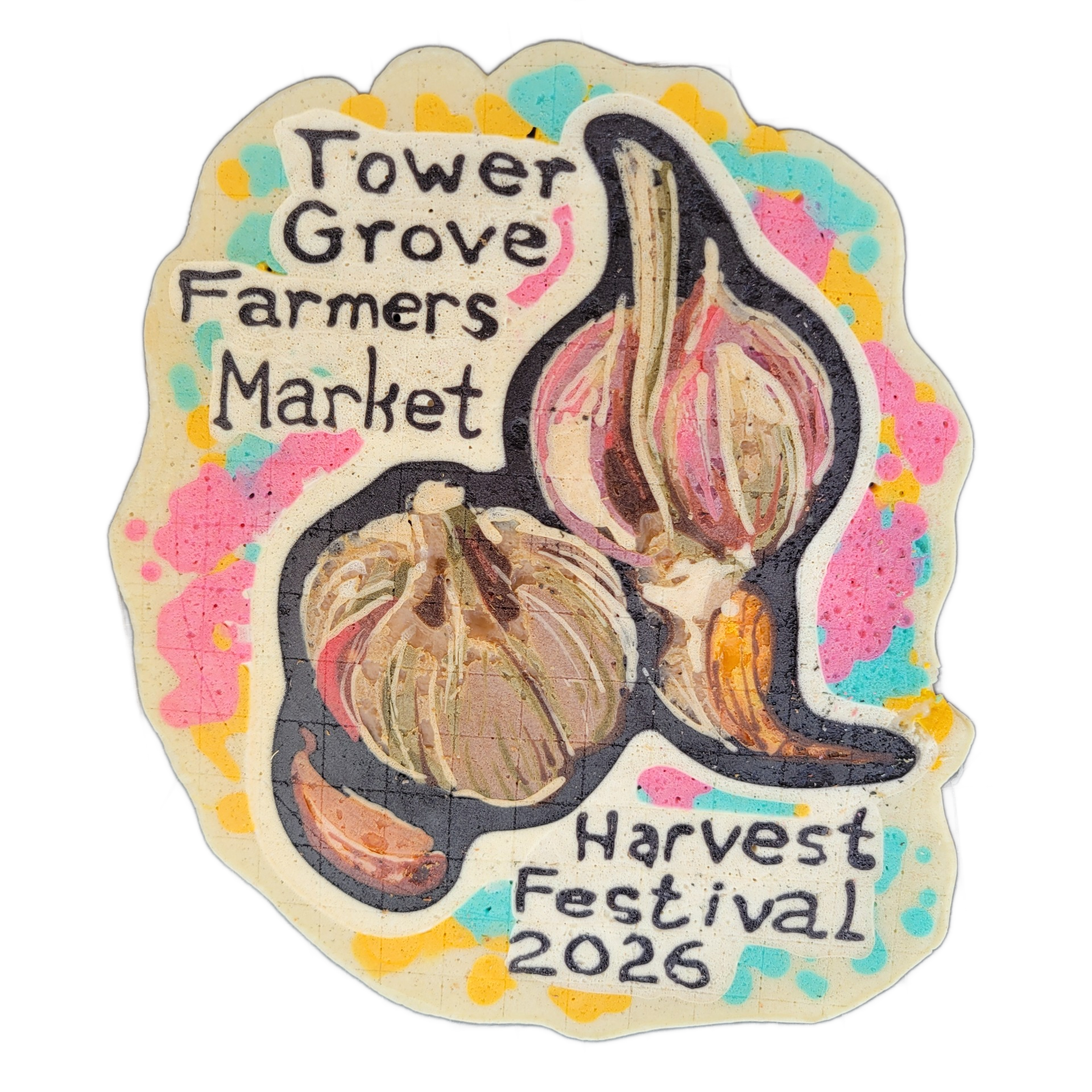 A pancake art piece depicting three garlic bulbs of varying sizes and one separated garlic clove, arranged together, with text reading 'Tower Grove Farmers Market' on the upper left and 'Harvest Festival 2026' on the lower right. The composition uses bold dark outlines around the garlic forms, fill…