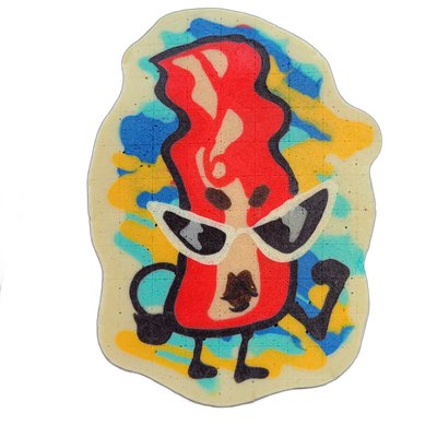 Pancake art depicting Sugar, a bacon strip character from the JoP cast, shown upright with small arms and legs, wearing white cat-eye sunglasses, with a large red flame-shaped form rising above her head and a small dark shape at her midsection. Rendered with bold black outlines and solid red fill f…