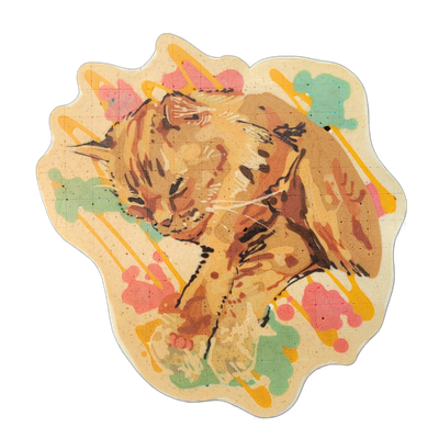 Pancake art of a cat named Walter, shown in a resting or crouching pose with the head turned slightly downward and whiskers visible, set against a background of paint-splatter-style blobs and drips in pink, teal, and yellow rendered in batter. The cat is illustrated with fine dark brown and black b…