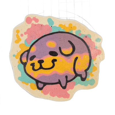 Pancake art depicting Poffridge, a Shiba Inu–shaped poffertje character from the JoP cast, shown in a rounded, compact form with stubby legs tucked beneath a large oval body and a flat muzzle with a small nose and curved mouth line. The piece uses bold black outlines with a palette of violet, yello…