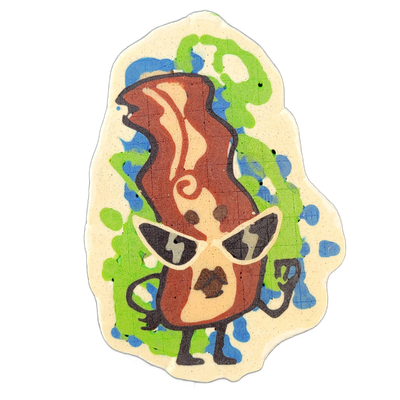 Pancake art of Sugar, a JoP original character depicted as an anthropomorphic strip of bacon with a humanoid body — arms, legs, and hands — wearing dark cat-eye-shaped glasses and posed with one hand raised near the face and the other extended outward; a loose spiral curl detail appears on the mids…