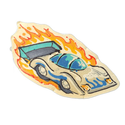 Pancake art of a low-slung racing car moving left to right, surrounded by large flames rising from behind and beneath the vehicle; the car has a teal and blue windshield, a rear spoiler, side pipes or vents rendered in blue, and a pale cream-colored body with bold black outlines. Lines are thick an…