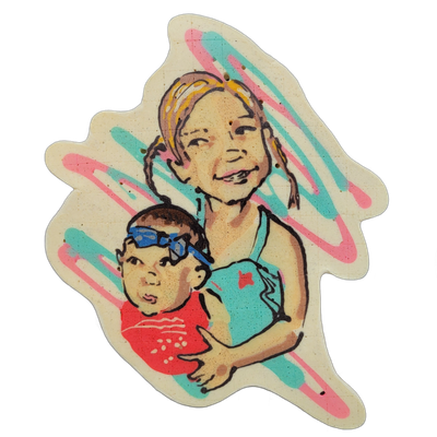 Pancake art depicting two figures named Carter and Emery: an older child with braided hair pulled back, smiling, wearing a teal swimsuit, holding a younger child or baby who wears blue swim goggles pushed up on their forehead and a red swimsuit. The piece uses bold black outlines with filled areas…