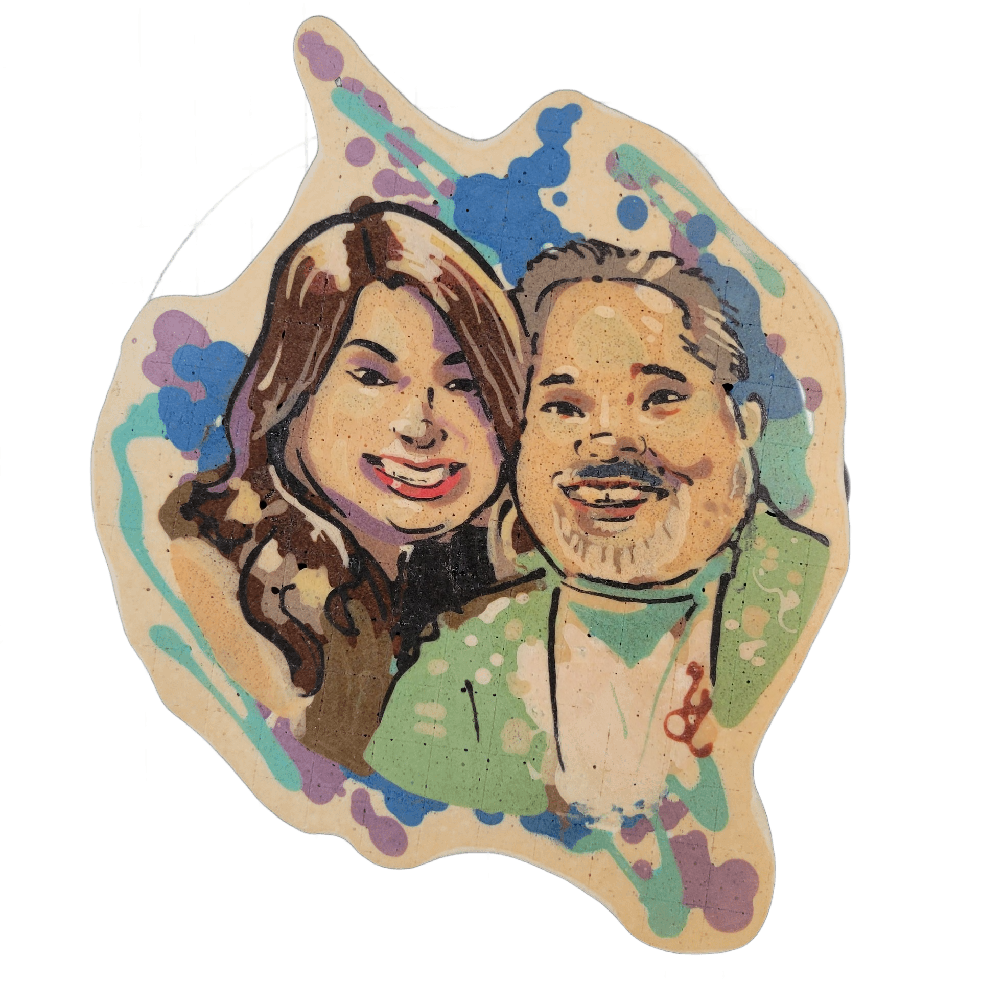 Pancake art depicting two smiling adults posed together, cheek to cheek: on the left, a person with long wavy brown hair and red lips; on the right, a person with short gray-brown hair, a goatee, and a green shirt with a small pendant visible at the collar. The piece uses bold dark outlines with fi…