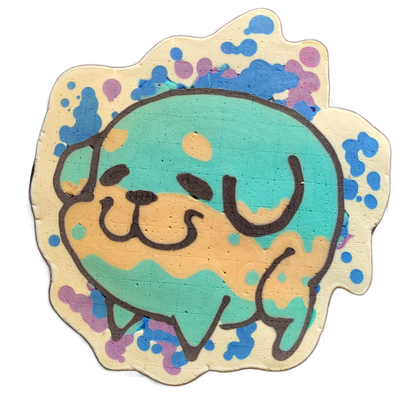 Pancake art depicting Poffridge, a Shiba Inu–shaped sentient poffertje from the JoP cast, shown as a round face with small oval eyes, a broad U-shaped smile, a rounded snout, and two paw shapes visible at the bottom, set against a teal-filled circular head area with a tan muzzle region and a scallo…
