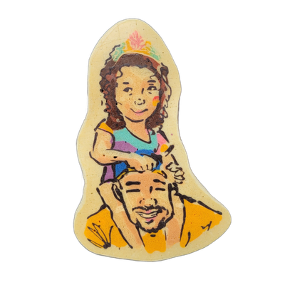 Pancake art depicting a young girl with curly hair and a colorful crown or floral headpiece sitting on the shoulders of a man with short hair, a beard, and a wide smile, both facing forward; the girl wears a multicolored striped top and rests her hands on the man's head. The piece uses bold black o…