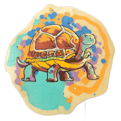 A tortoise rendered in pancake art, shown in profile facing right, with a large domed shell divided into polygonal sections colored in brown and yellow-orange, a teal-green head and neck with small decorative curls at the joints, four thick legs with clawed toes, and a short tail. Bold black outlin…