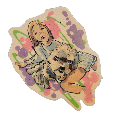 Pancake art depicting a light-skinned child with chin-length blond hair and an open mouth, holding or supporting a large fluffy tan-and-brown dog with a broad face, dark nose, and shaggy fur, set against a background splattered with pink, violet, and green batter in loose blob and swirl shapes. Ren…