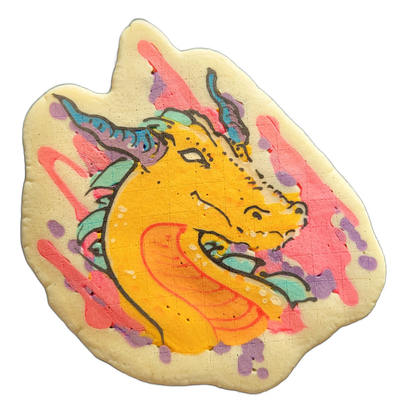 A dragon head facing right, rendered in yellow and orange with teal and blue horns and mane-like scales along the back of the skull, set against a background of pink drips and purple spots on a cream-colored base. The art uses bold dark outlines, broad color fills in the face and neck area, and loo…