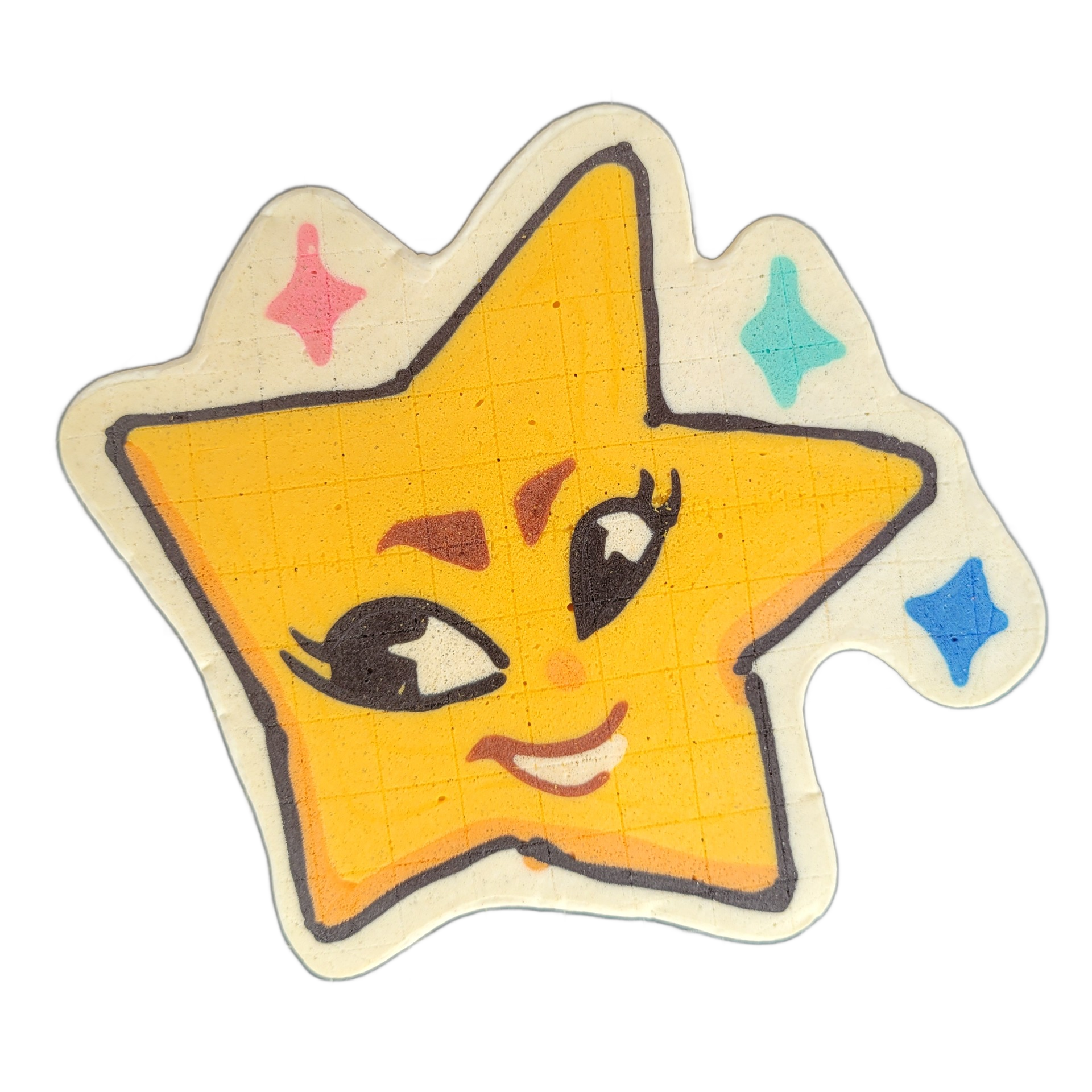 Pancake art of Charli, an original JoP character depicted as a five-pointed star with a cartoon face, featuring large asymmetric eyes with lashes (one open wide, one more narrowed), reddish-brown blushed cheeks, a small nose, and a slight open-mouthed smile showing teeth, surrounded by four small f…