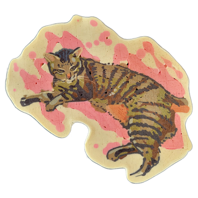 A tabby cat named Amelia lies in a relaxed pose, body stretched horizontally with front paws extended forward and tail curling downward, rendered on a cream-colored background with irregular, organic edges and pink batter splattered across the background area. The cat is illustrated with fine dark…