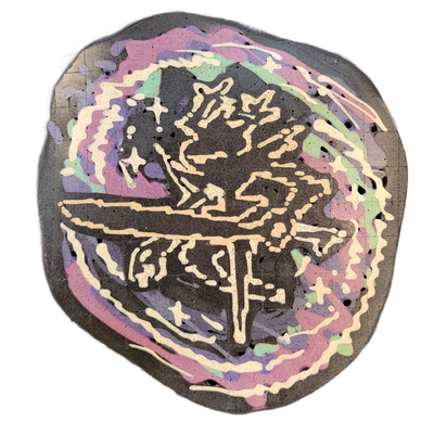 Pancake art of The Roaring Knight, a figure depicted in dark batter with a bold white-outlined form that includes a cross or sword shape at the lower center and an upper body with raised, jagged limbs or appendages suggesting motion or aggression. The piece uses fine-to-medium white batter lines fo…