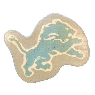 Pancake art depicting a leaping lion in profile, rendered in the style of the Detroit Lions NFL logo, with the lion shown mid-stride facing right, forelegs extended and tail raised. The piece uses bold white outlines against a teal-blue fill for the lion's body, with fine white interior lines indic…