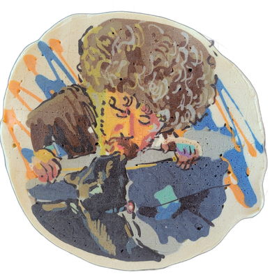 Pancake art depicting a person with large, voluminous curly hair, rendered from roughly the waist up, holding what appears to be a microphone or cylindrical object close to their mouth, with their face partially illuminated in warm orange and pink tones against a darker upper body rendered in deep…