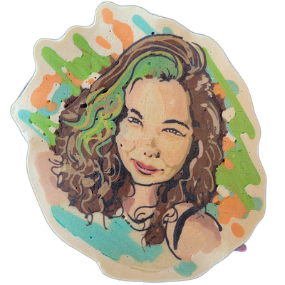 A pancake art portrait of a woman with long, voluminous curly brown hair, light skin tone, and a slight smile, shown from the shoulders up against a background of loose brushstroke-style splotches in green, teal, and orange. The portrait uses bold dark outlines for the facial features and hair curl…