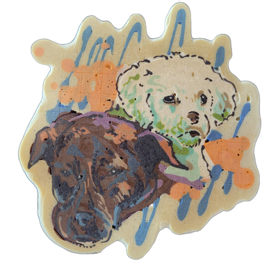 Pancake art depicting two dog portraits side by side: a darker dog with brown, gray, and black tones on the left, and a lighter, fluffier-looking dog with cream and light gray tones on the right, both shown from approximately the neck up. The piece uses bold outlines with expressive batter strokes,…