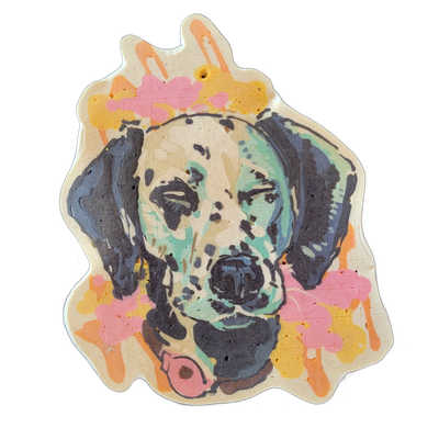 A pancake art portrait of a Dalmatian dog's head and upper neck, facing forward, with floppy ears framing the face and a collar with a round tag visible at the bottom. The portrait uses bold dark outlines with teal, cream, and dark gray fill areas on the face, surrounded by splashes and drips of or…