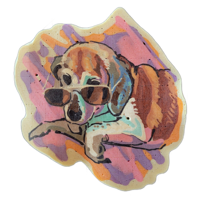 A pancake art portrait of a dog wearing large dark sunglasses, shown from roughly the chest up with its front legs extended forward and crossed, set against a layered abstract background. Bold black outlines define the figure and face, with fill areas in orange, tan, and brown for the dog's coat, a…