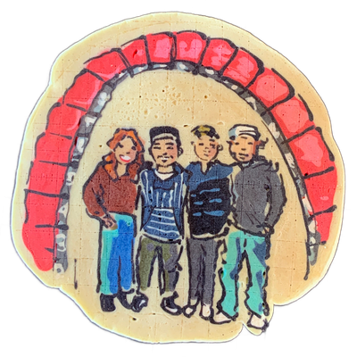 A pancake art piece titled 'The Arch,' depicting four figures standing side by side beneath a large brick arch rendered in red and gray; the leftmost figure has red-orange hair and wears a brown top with light blue pants, the second wears a striped blue and white shirt with olive pants, the third w…