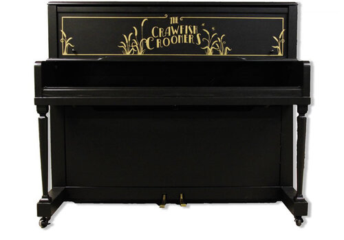 An upright piano shell prepared for the stage, studio or home