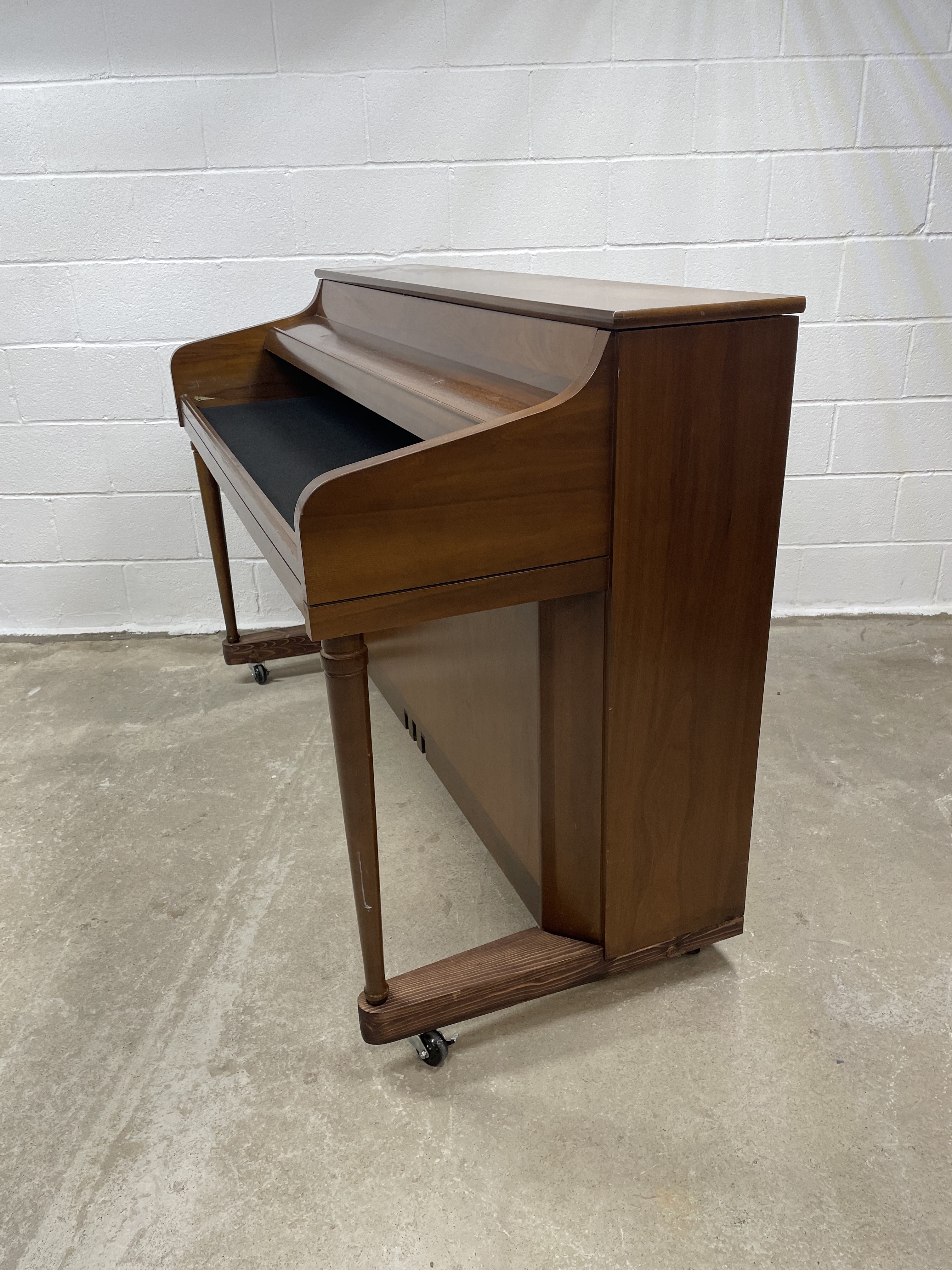 An upright piano shell prepared for the stage, studio or home