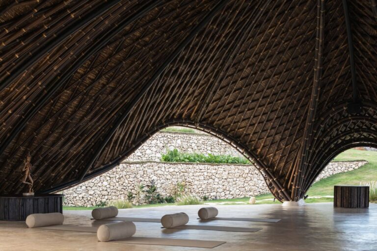 A diverse group of people sitting in a circle, collaborating.