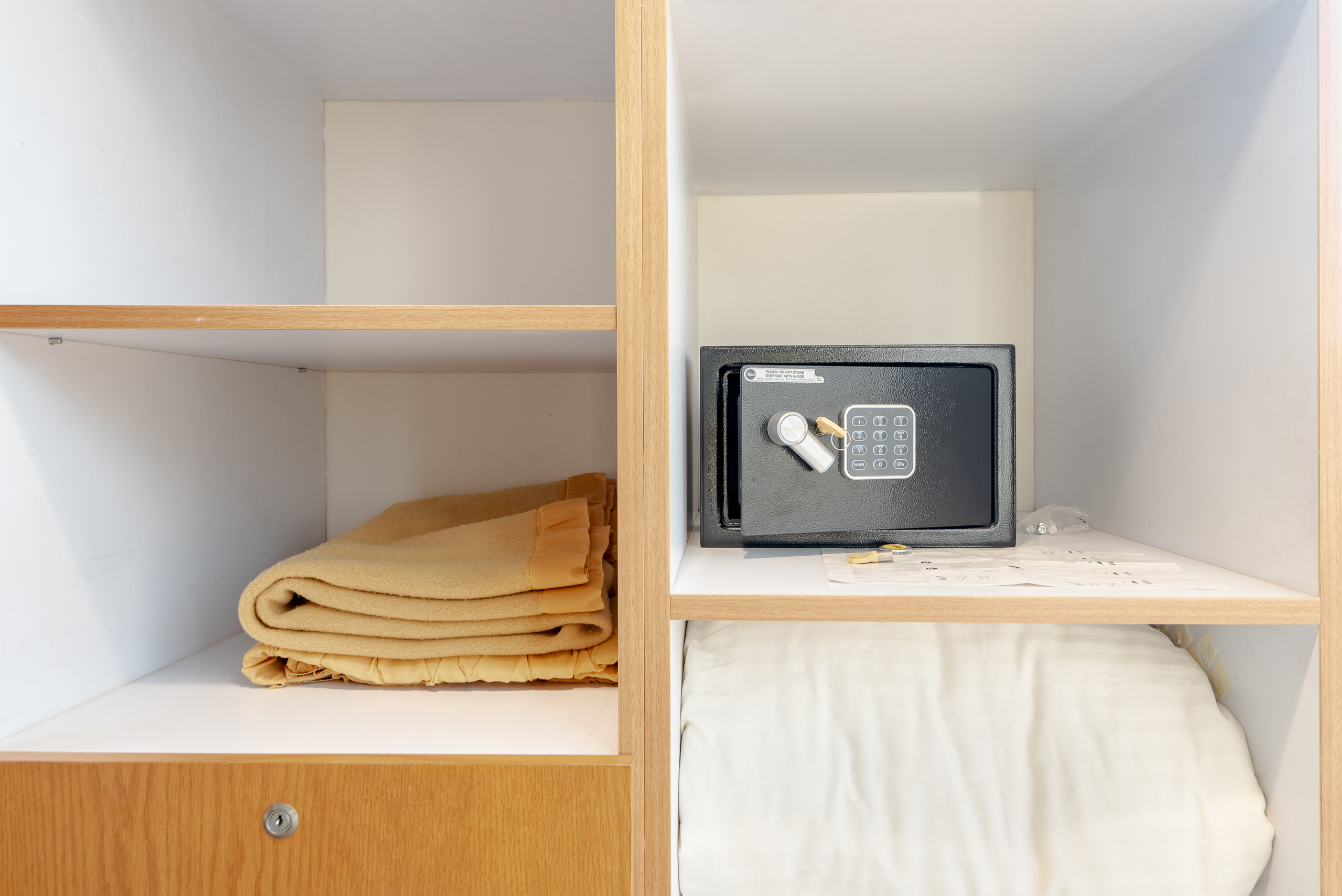 Closet shelves with folded linens.
