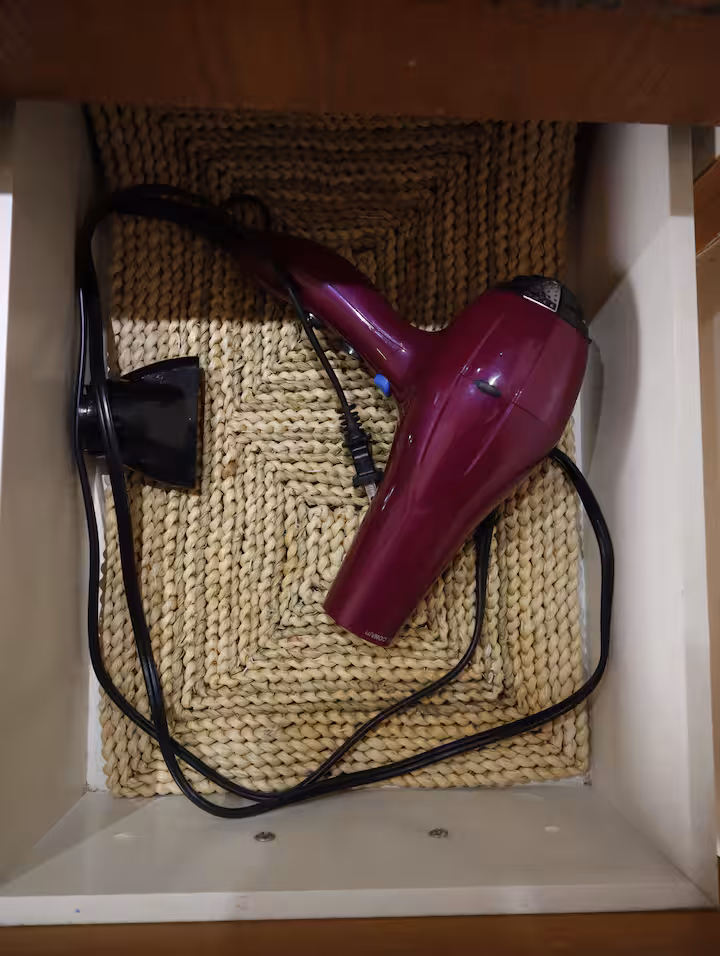 Hair dryer in a drawer.