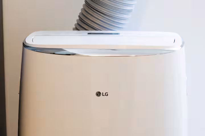 Portable air conditioner with an exhaust hose.