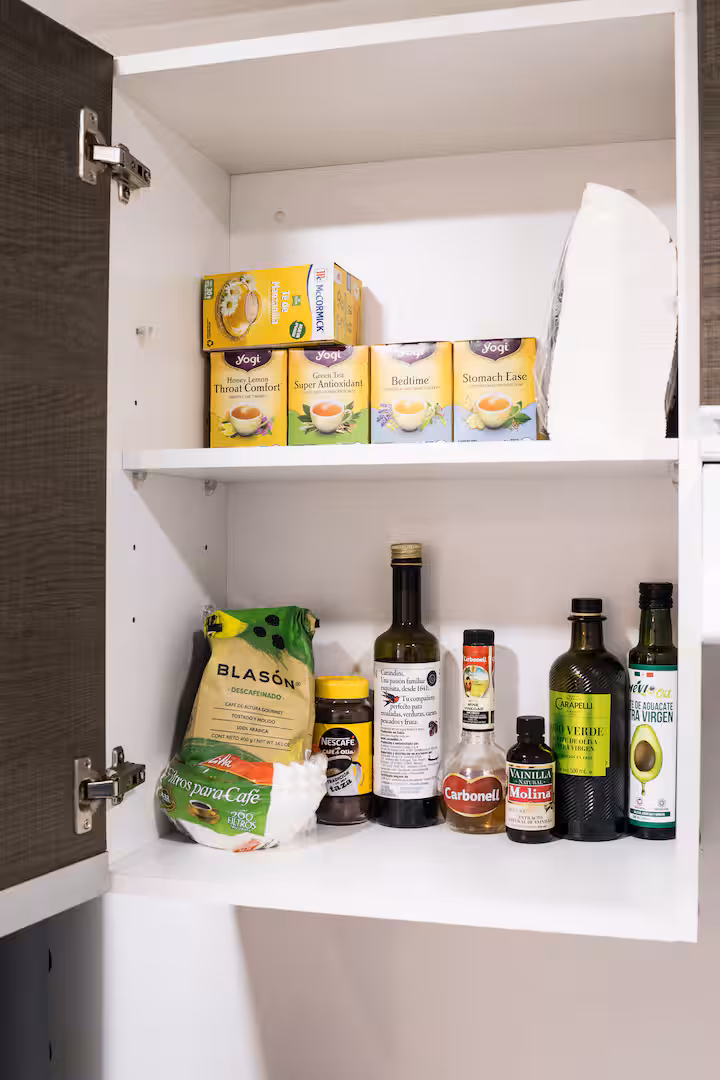 Pantry shelf with cooking staples.