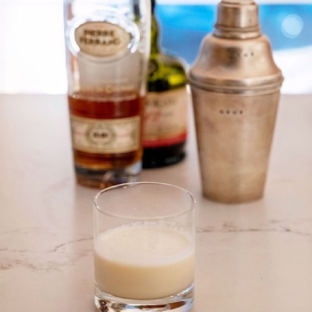 This drink is a riff on the Parisian Blond from the Savoy Cocktail Book, and a traditional White Russian. The rum and cognac both have lots of vanilla notes. The fats in the cream help to amplify the flavors. Feel free to adjust the sweetness with more or less simple syrup.